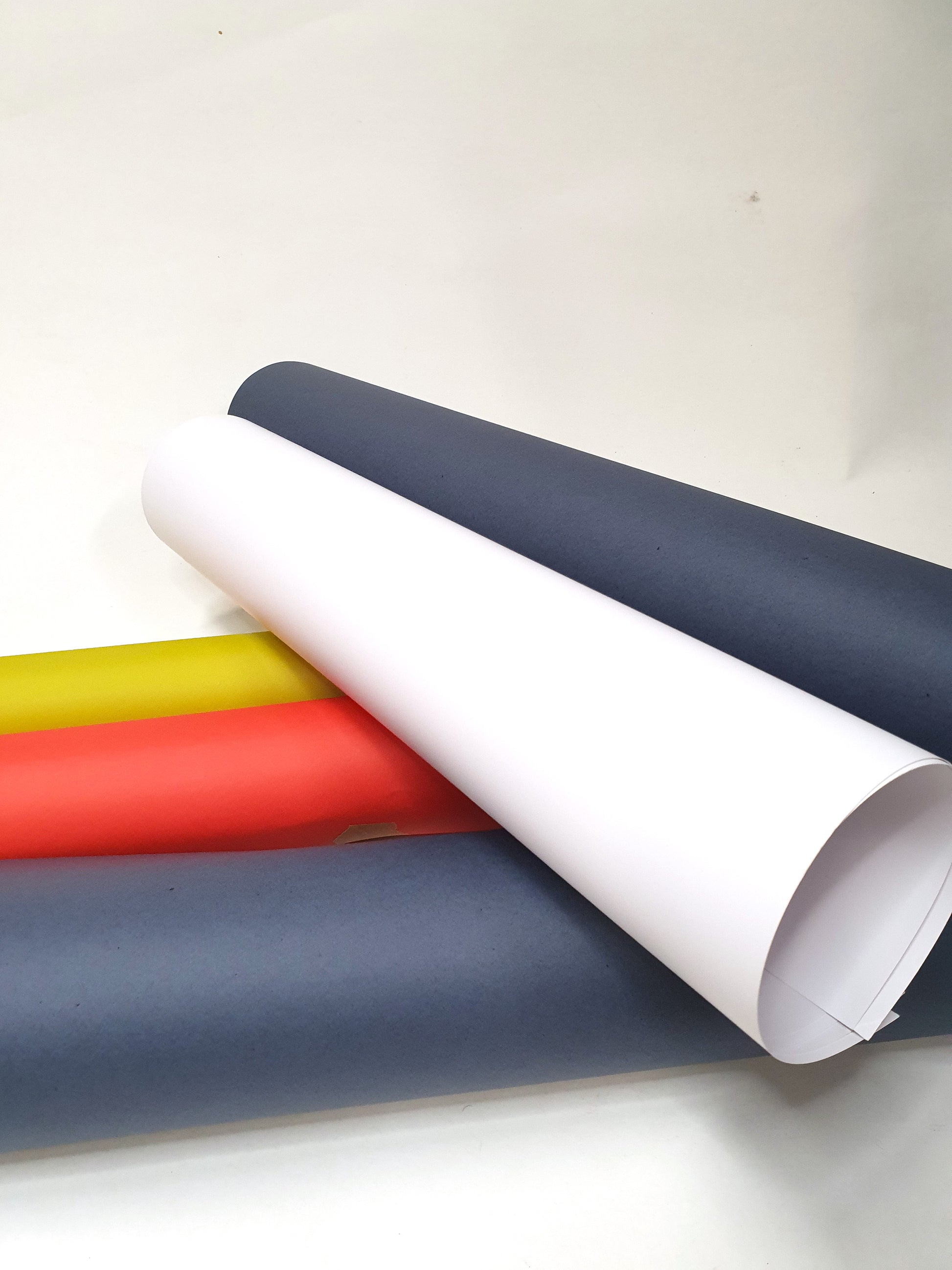 Close-up of a collection of rolled coloured papers