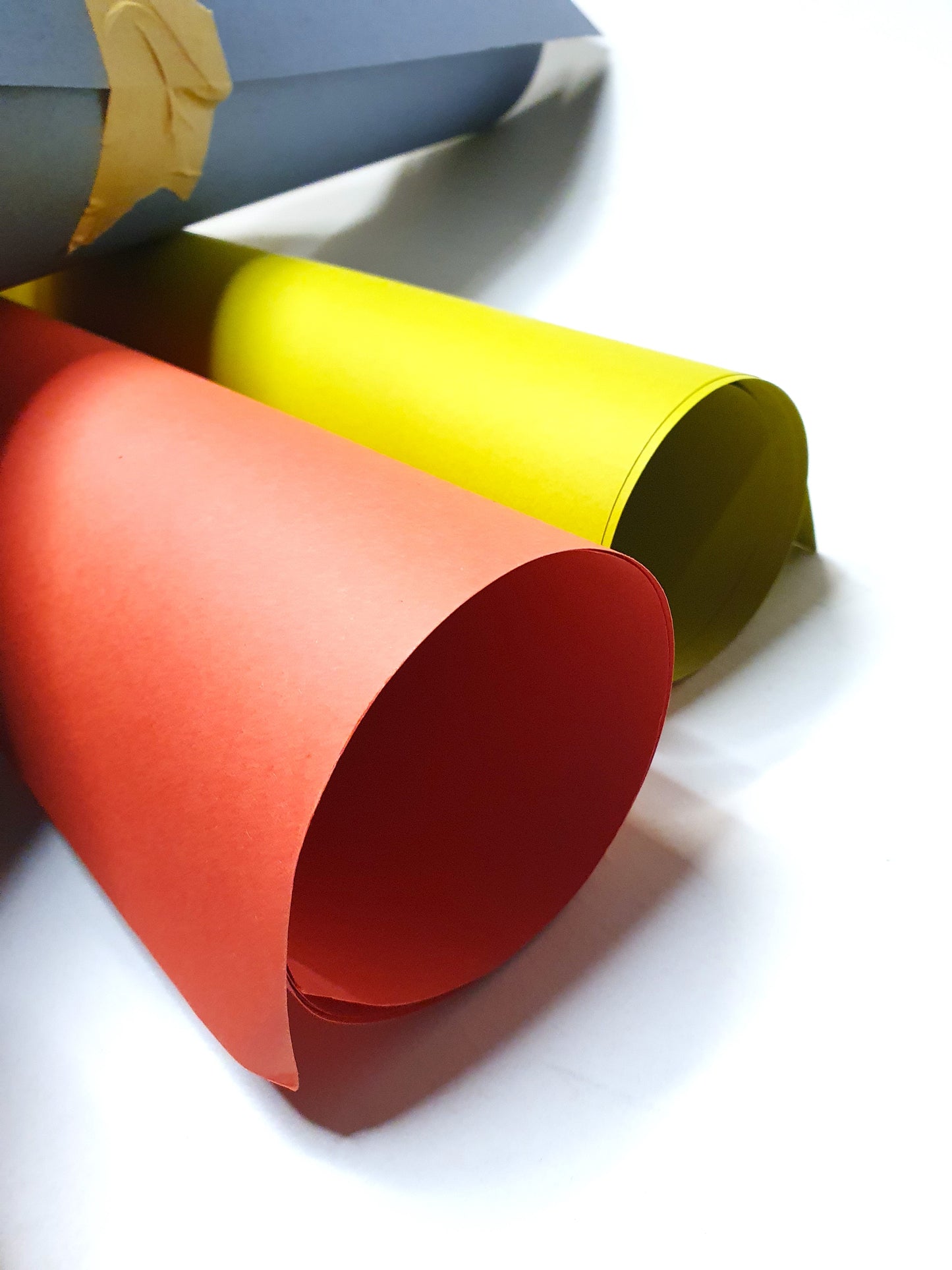 Close-up of a collection of rolled coloured papers
