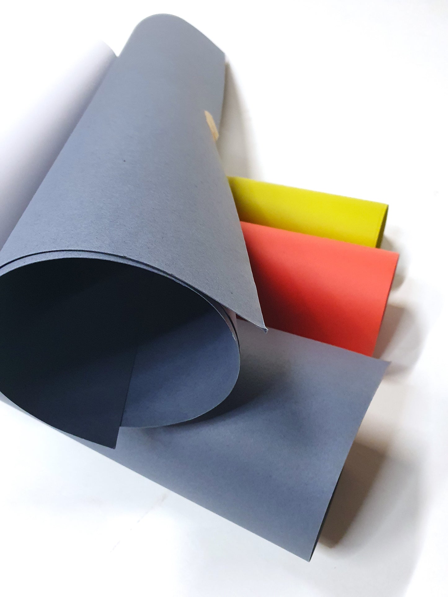 Close-up of a collection of rolled coloured papers