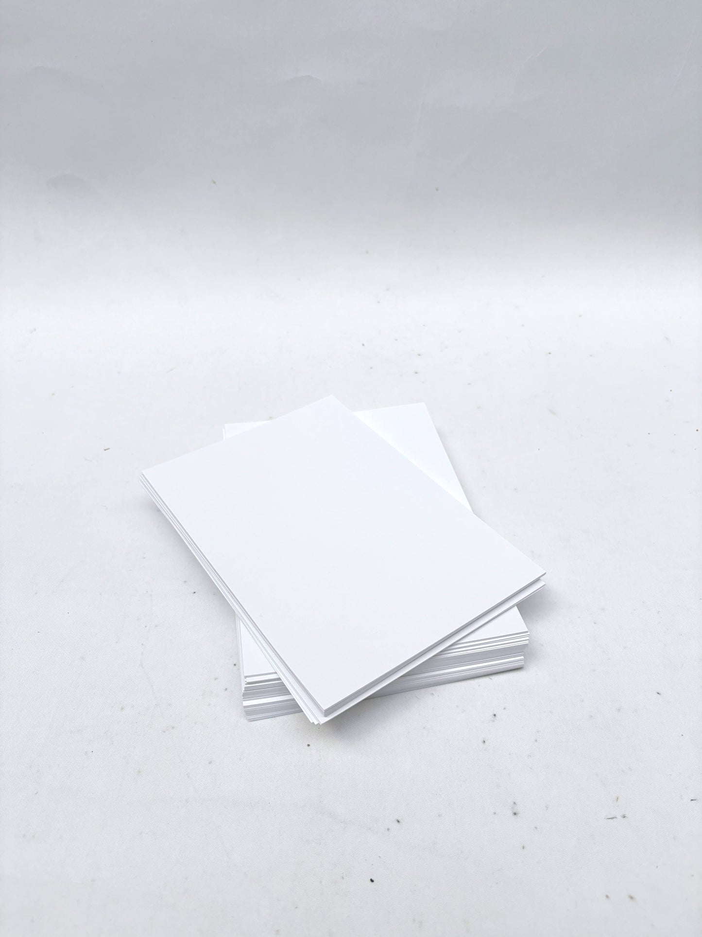 A stack of rectangular white paper