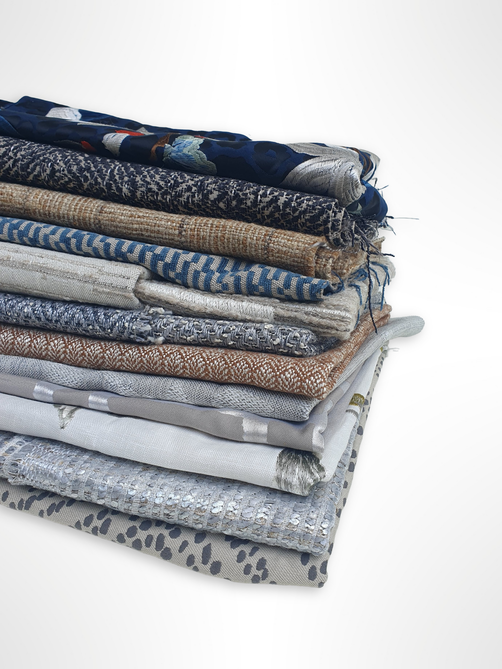 Stack of various patterned fabrics with various colours 