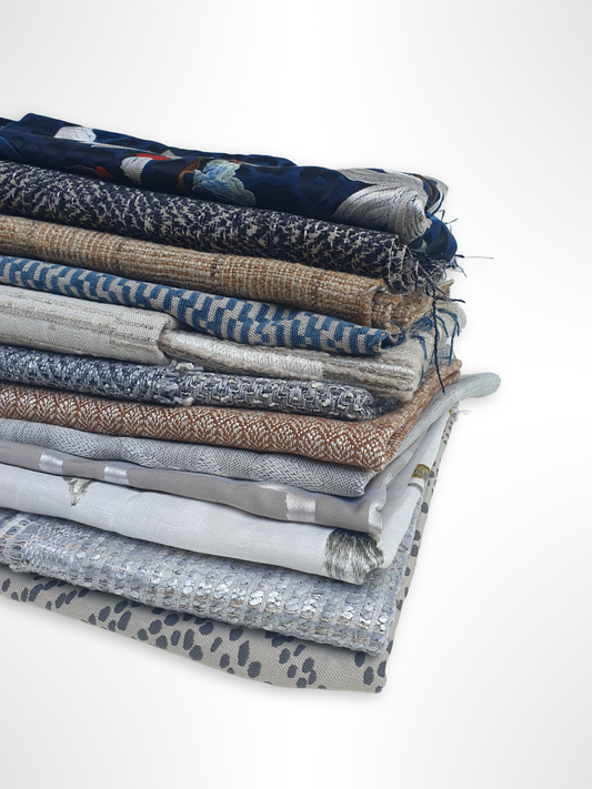 Stack of various patterned fabrics with various colours 