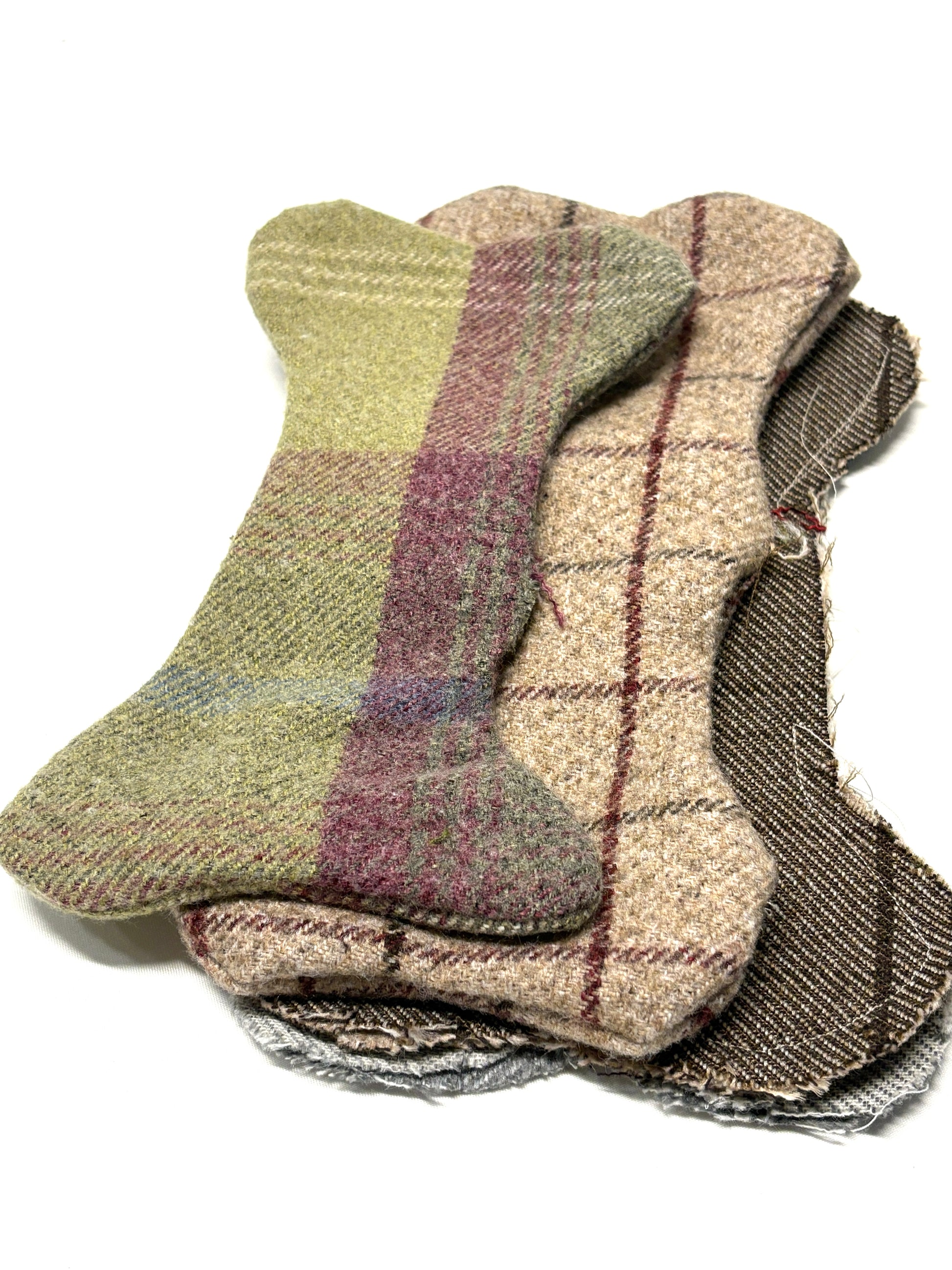 Stack of plaid patterned bone-shaped fabric 