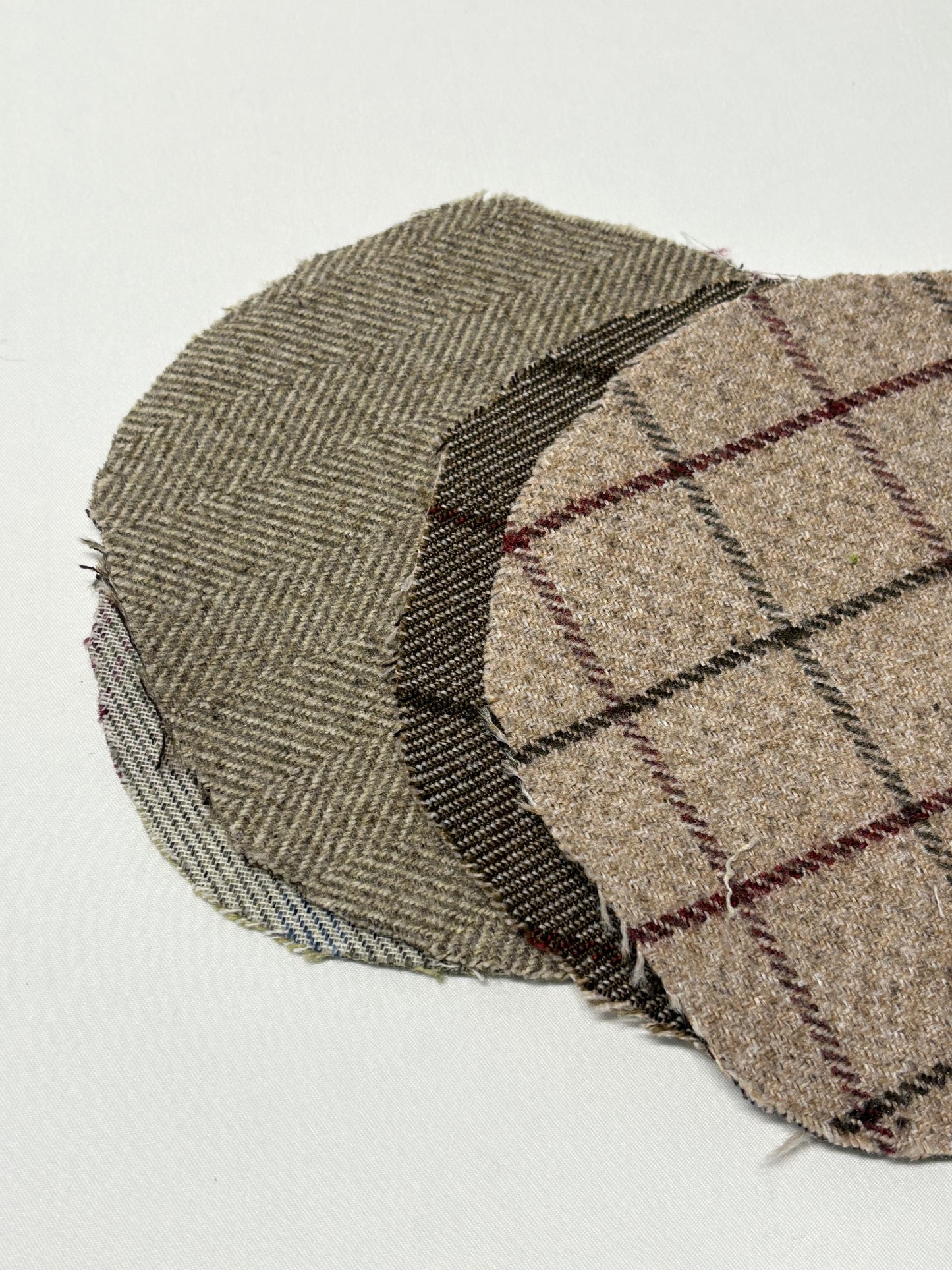 Stack of plaid patterned round-shaped fabric 
