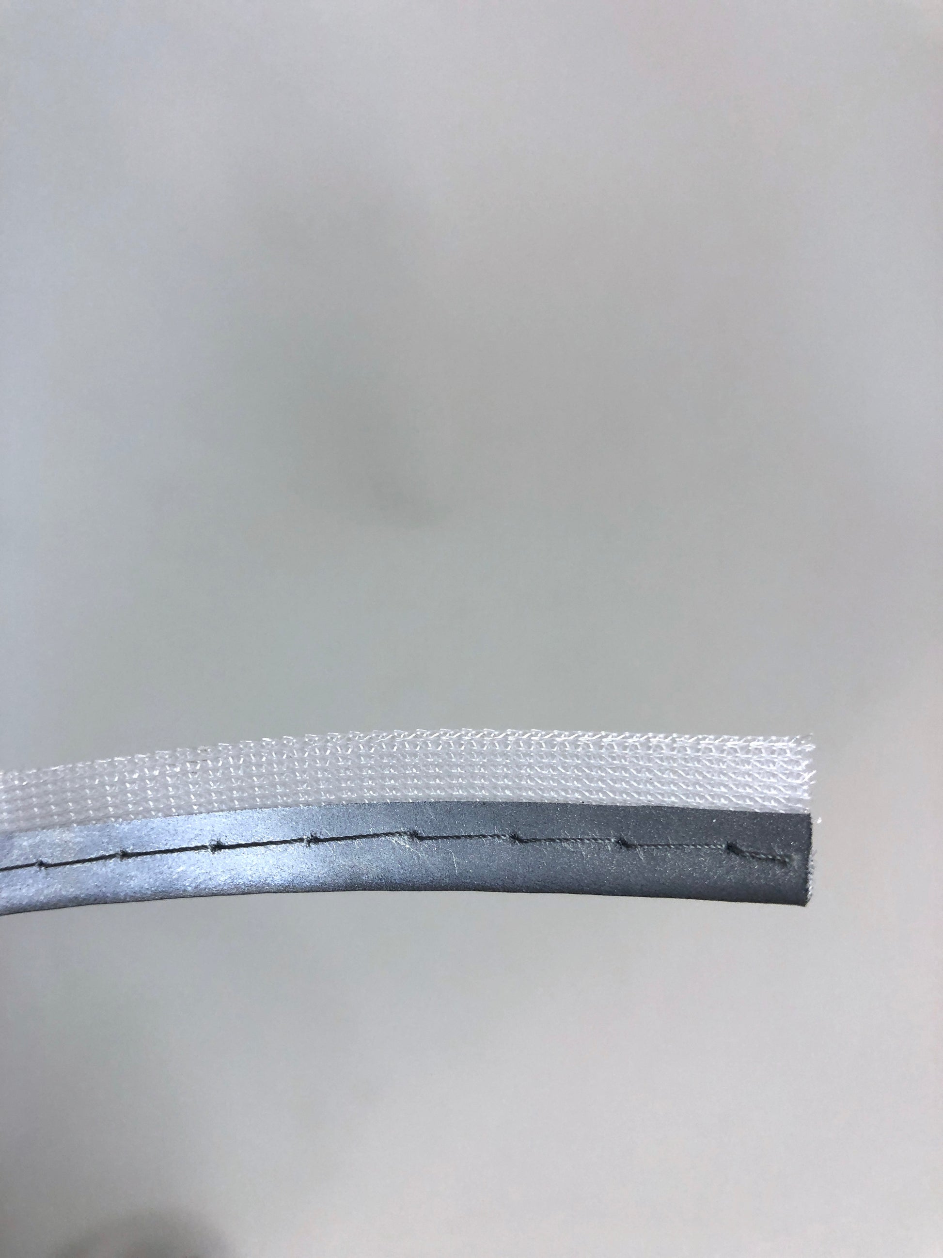 Close-up of silver reflective piping tape, shiny texture can be seen