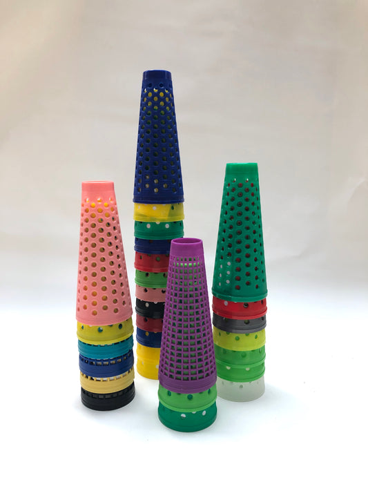 A collection of colourful plastic cones with small dotted holes