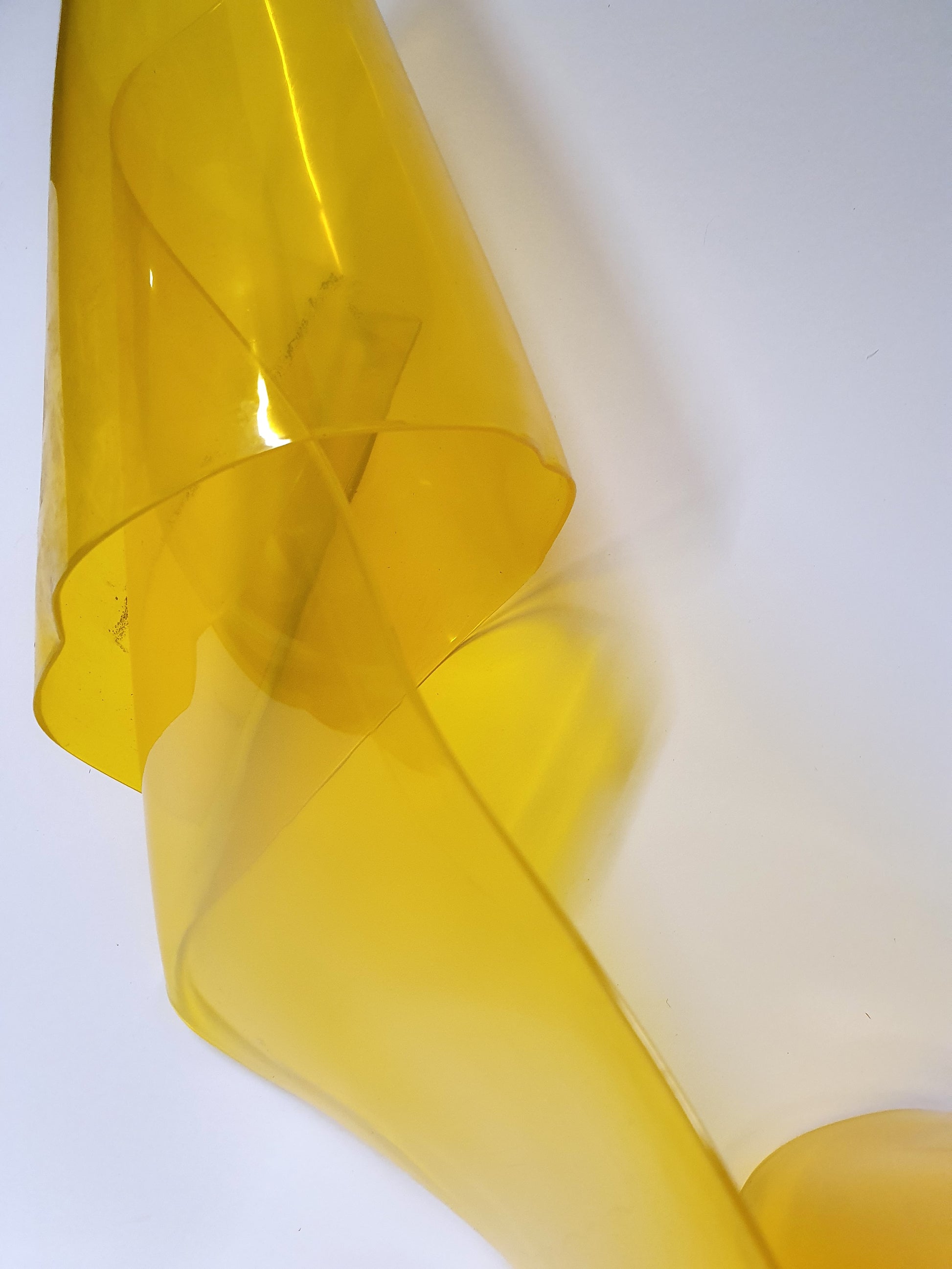 Unfolded yellow PVC strip curtain.