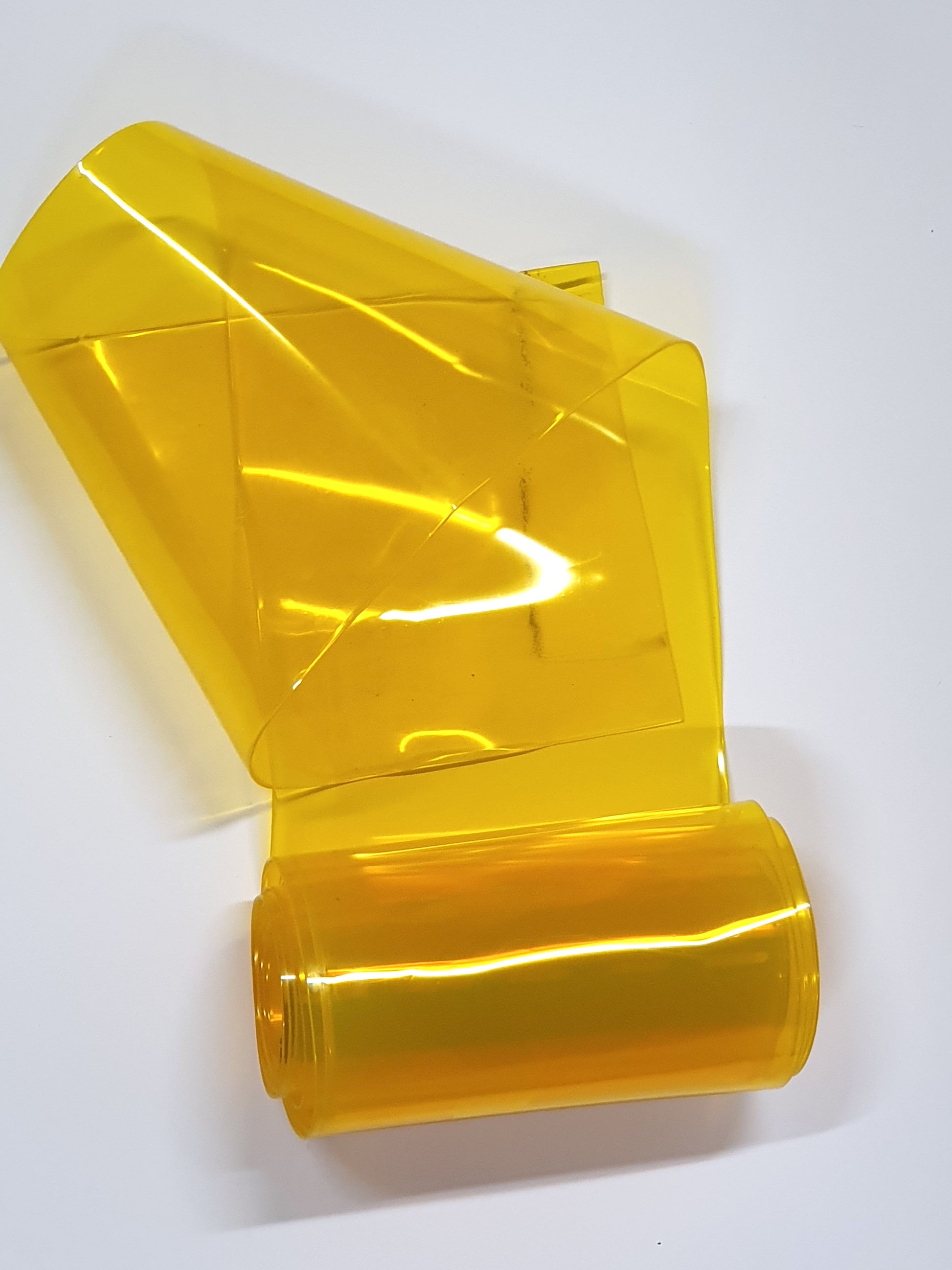 Partially unfolded yellow PVC strip curtain.