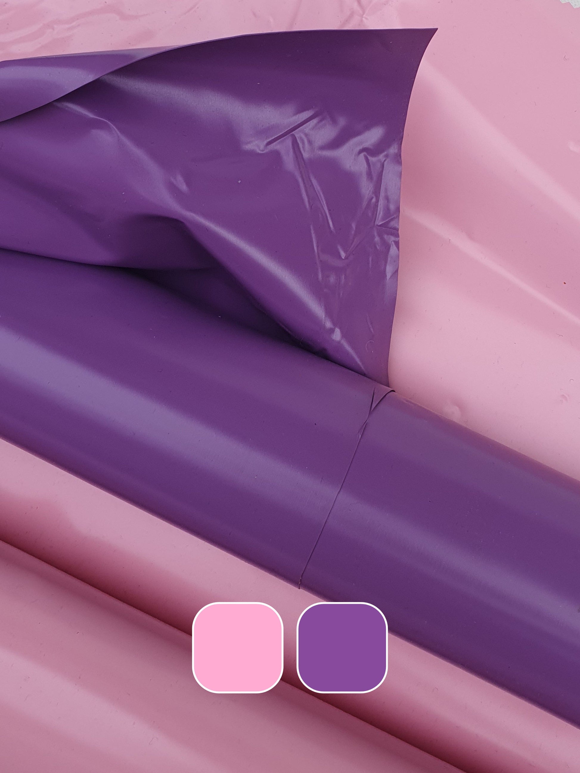 Close-up of pink and purple shiny plastic film with colour swatches 