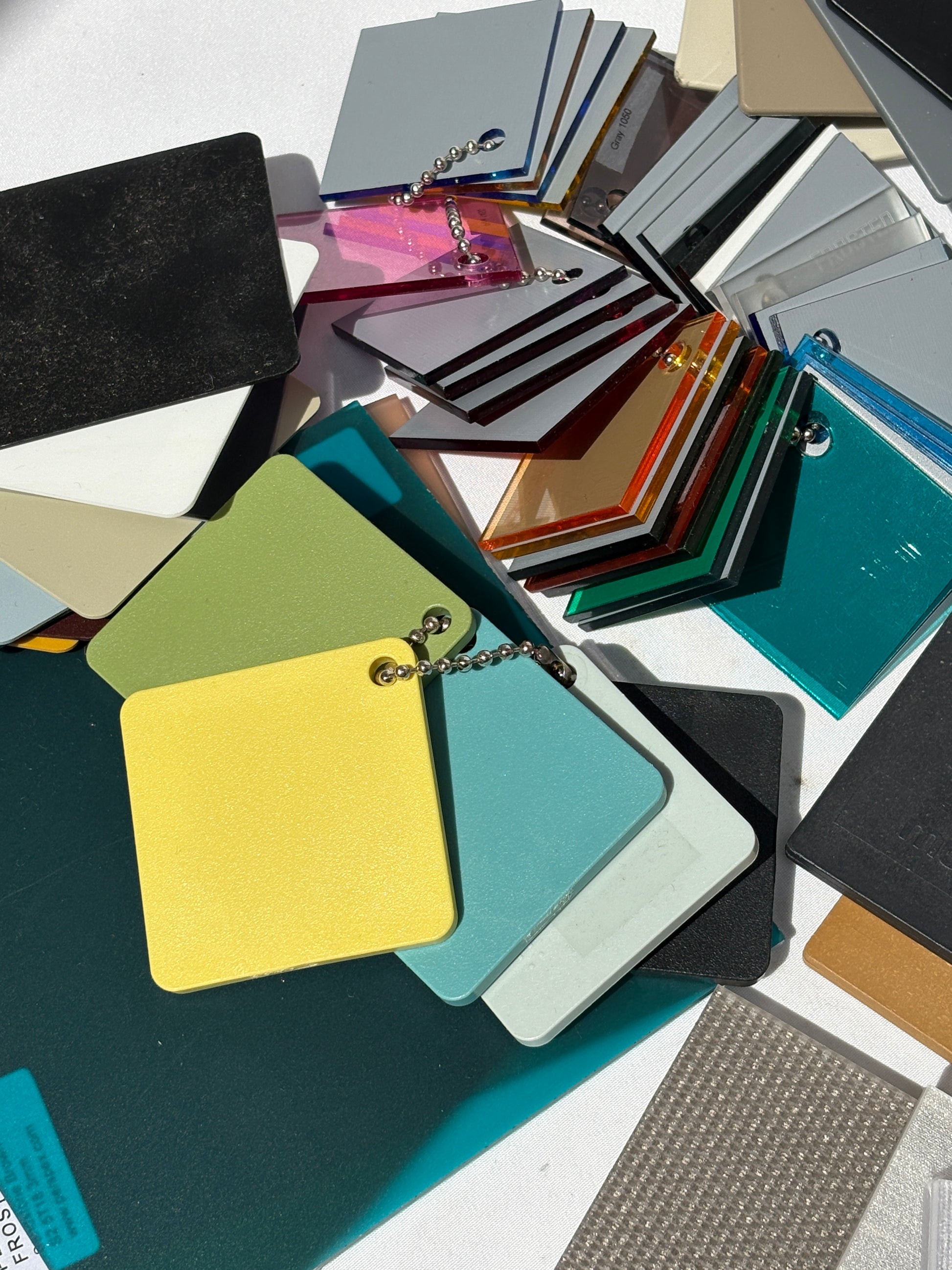 Collection of bundles of colour plastic architectural samples 
