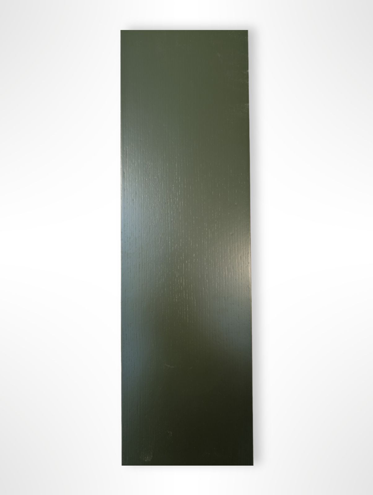 A green-painted pine plinth with a visible wood grain texture