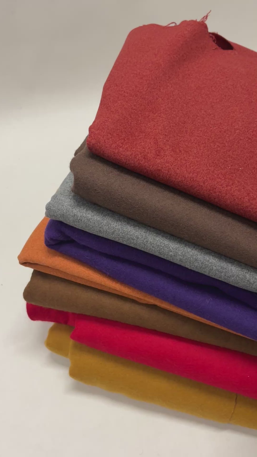 A video showing each folded felt fabric in various colours