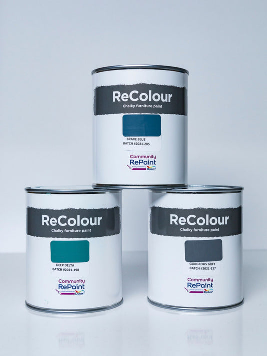 Three cans of ReColour chalky acrylic furniture paint, various shades of blue paint.