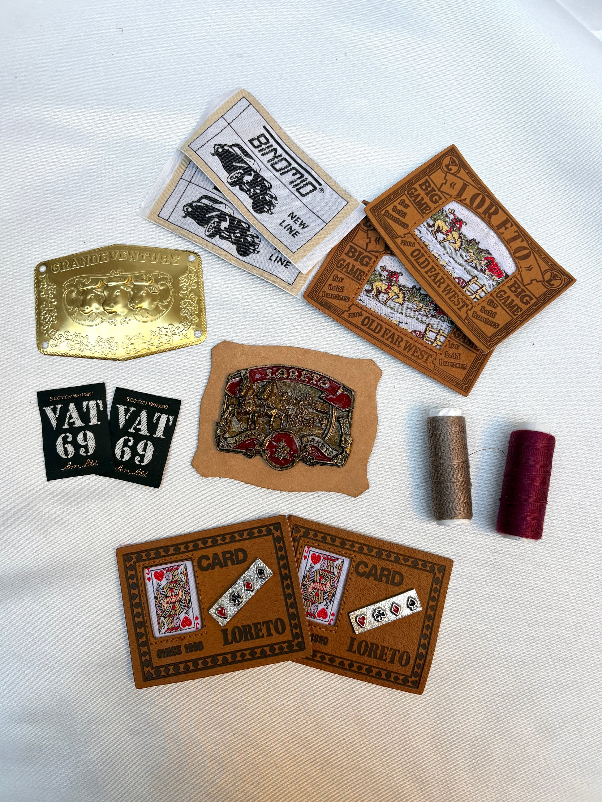 Collection of vintage-style labels and patches on a white background