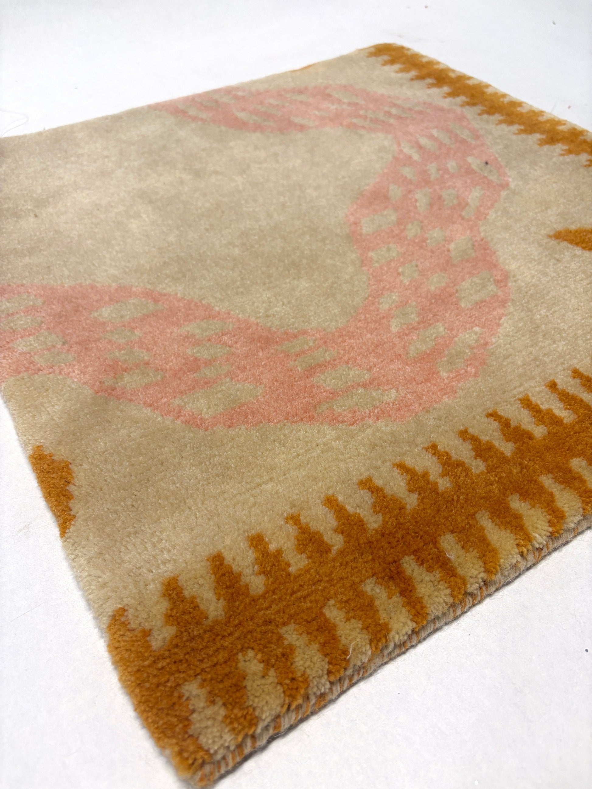 Beige, pink and brown abstract patterned rug sample