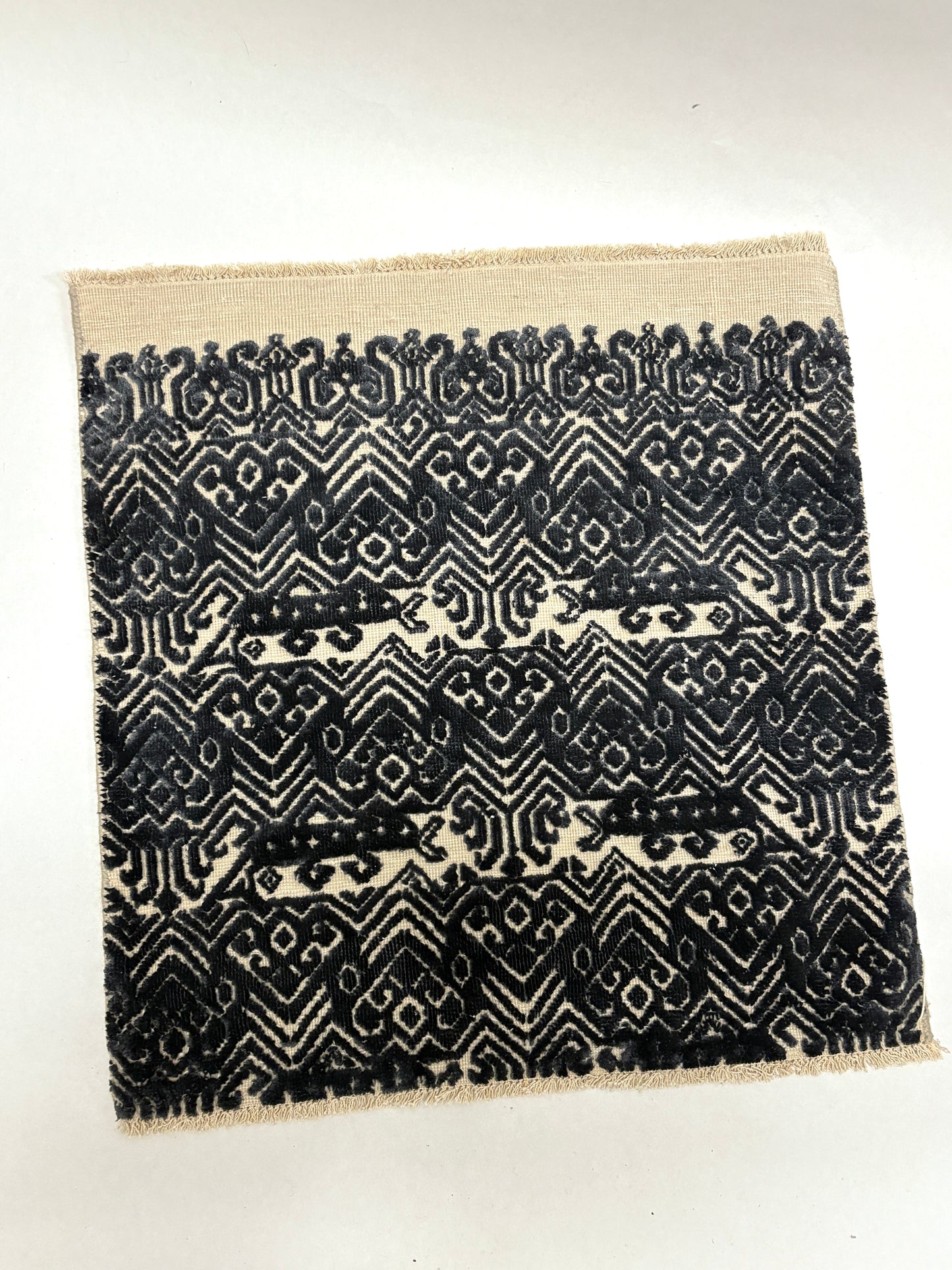 Black and white geometric patterned rug sample