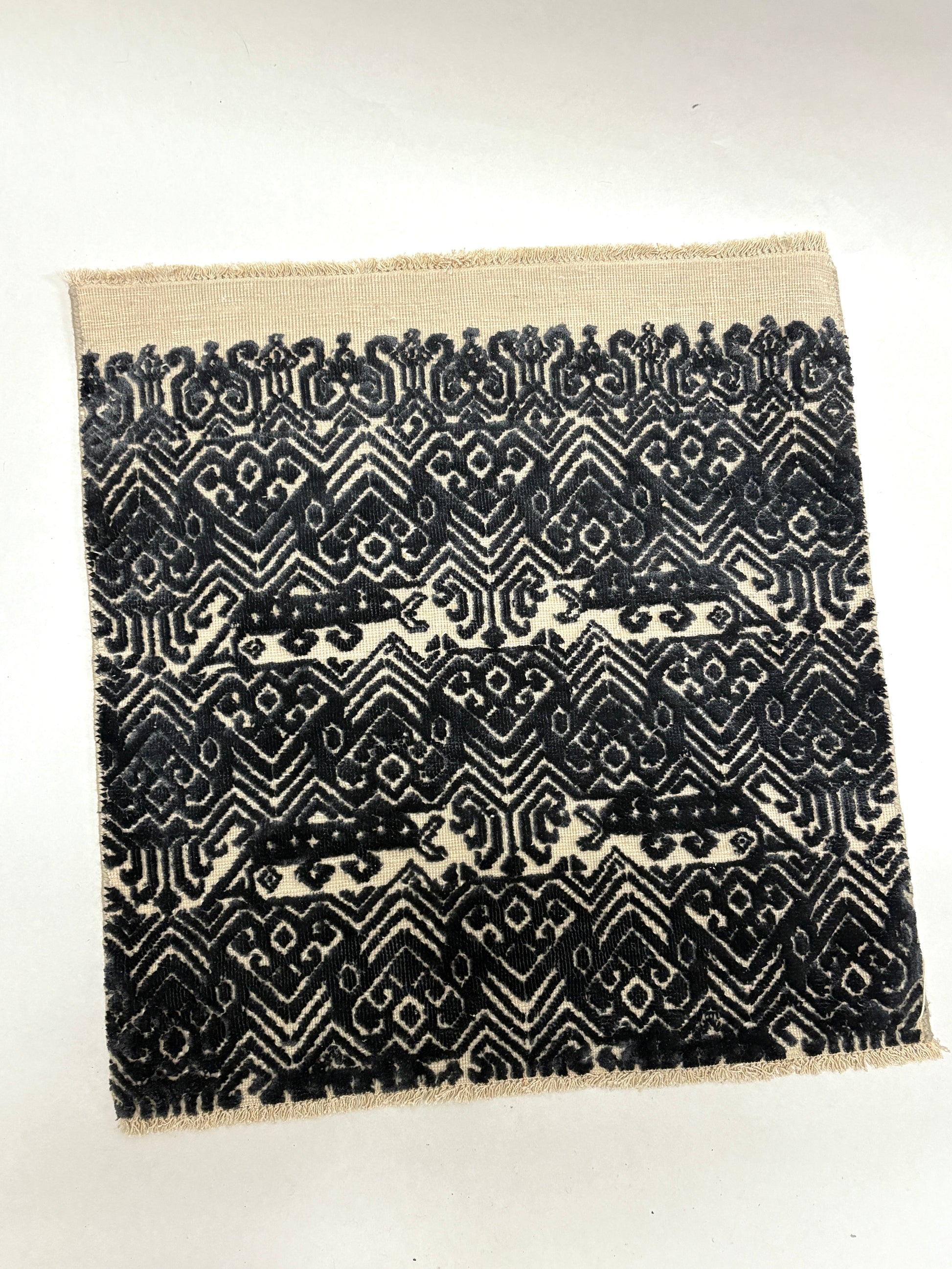 Black and white geometric patterned rug sample