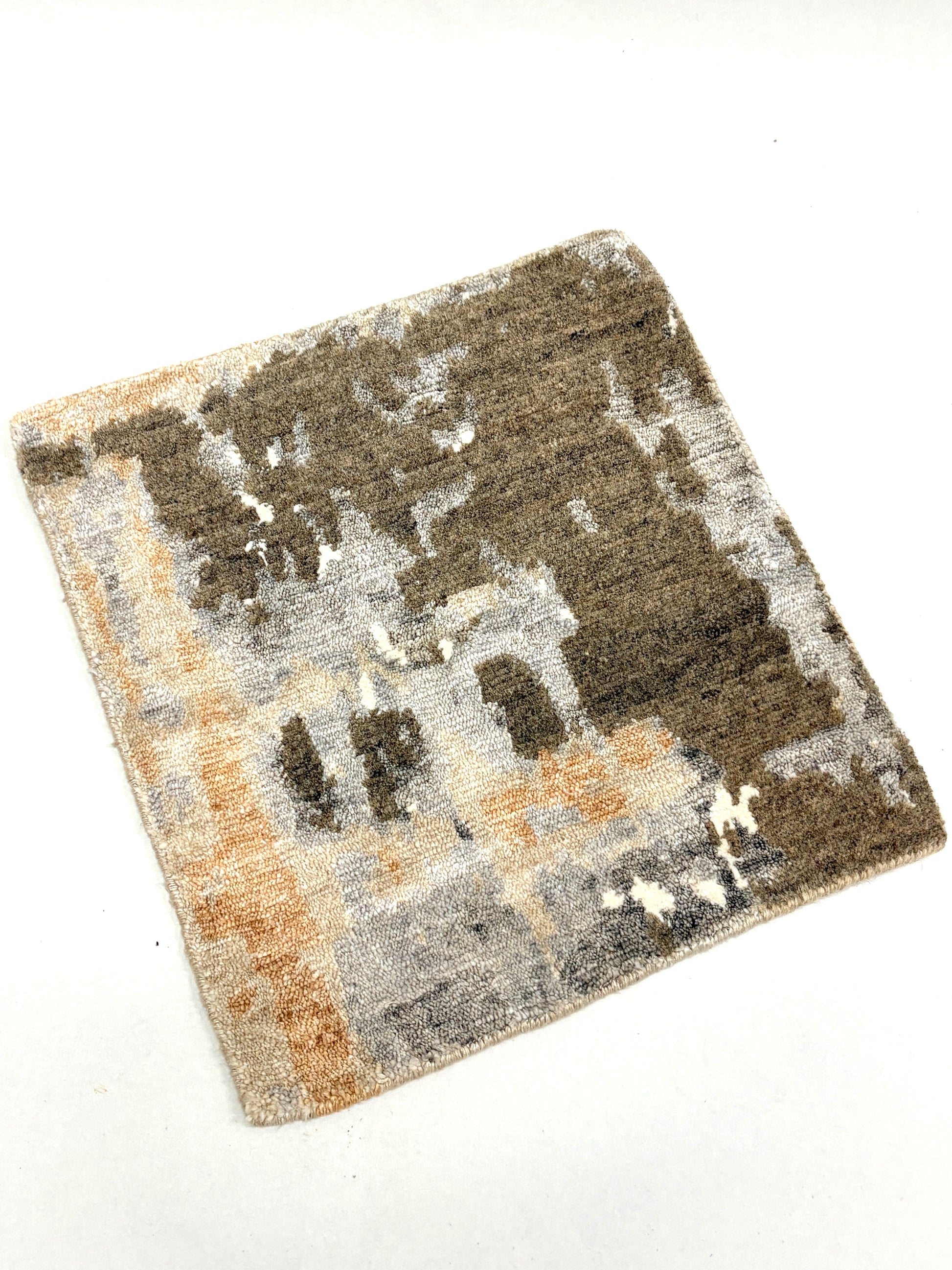 Moss green, white, and brown abstract-patterned rug sample