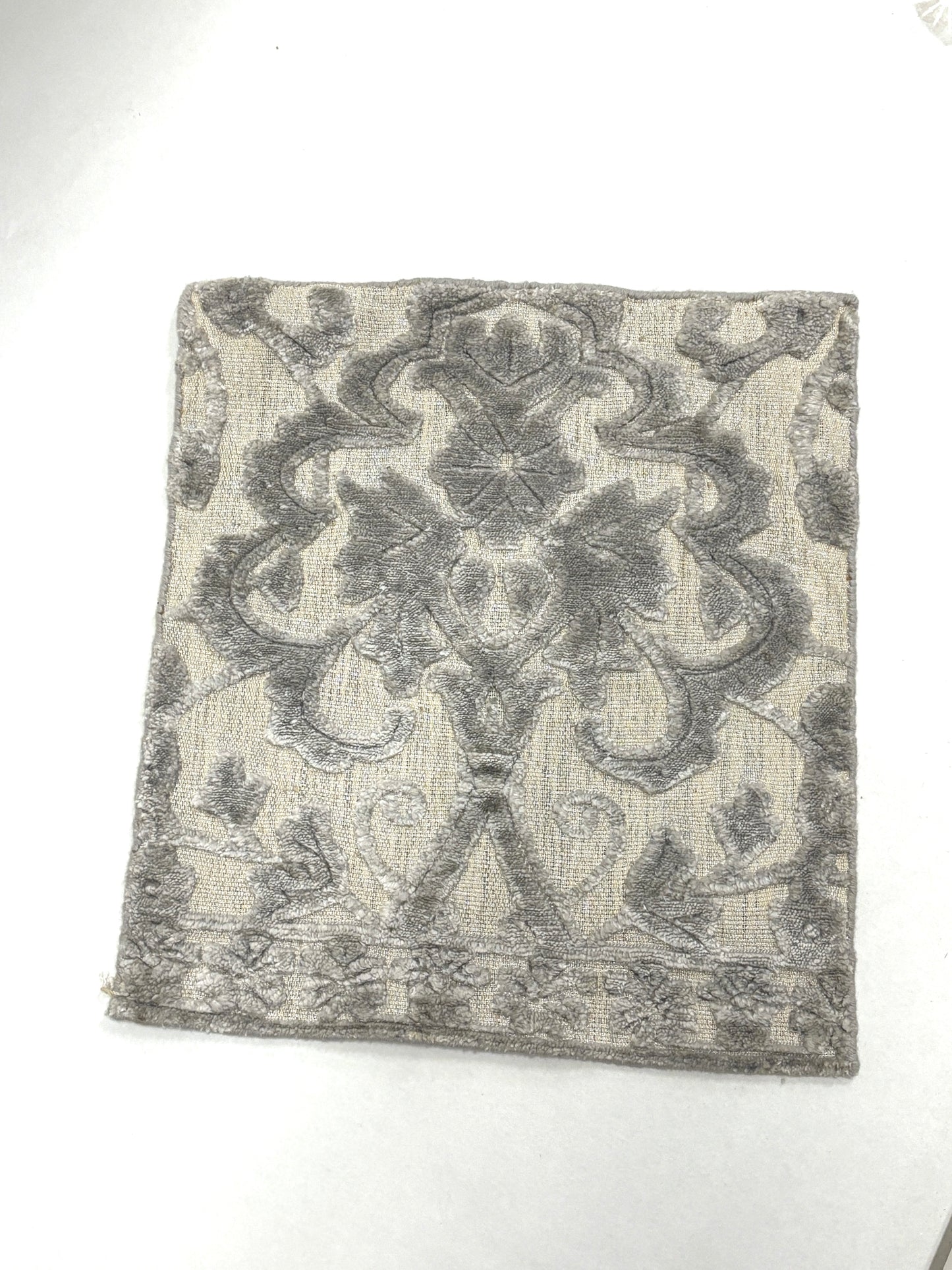Damask patterned rug sample