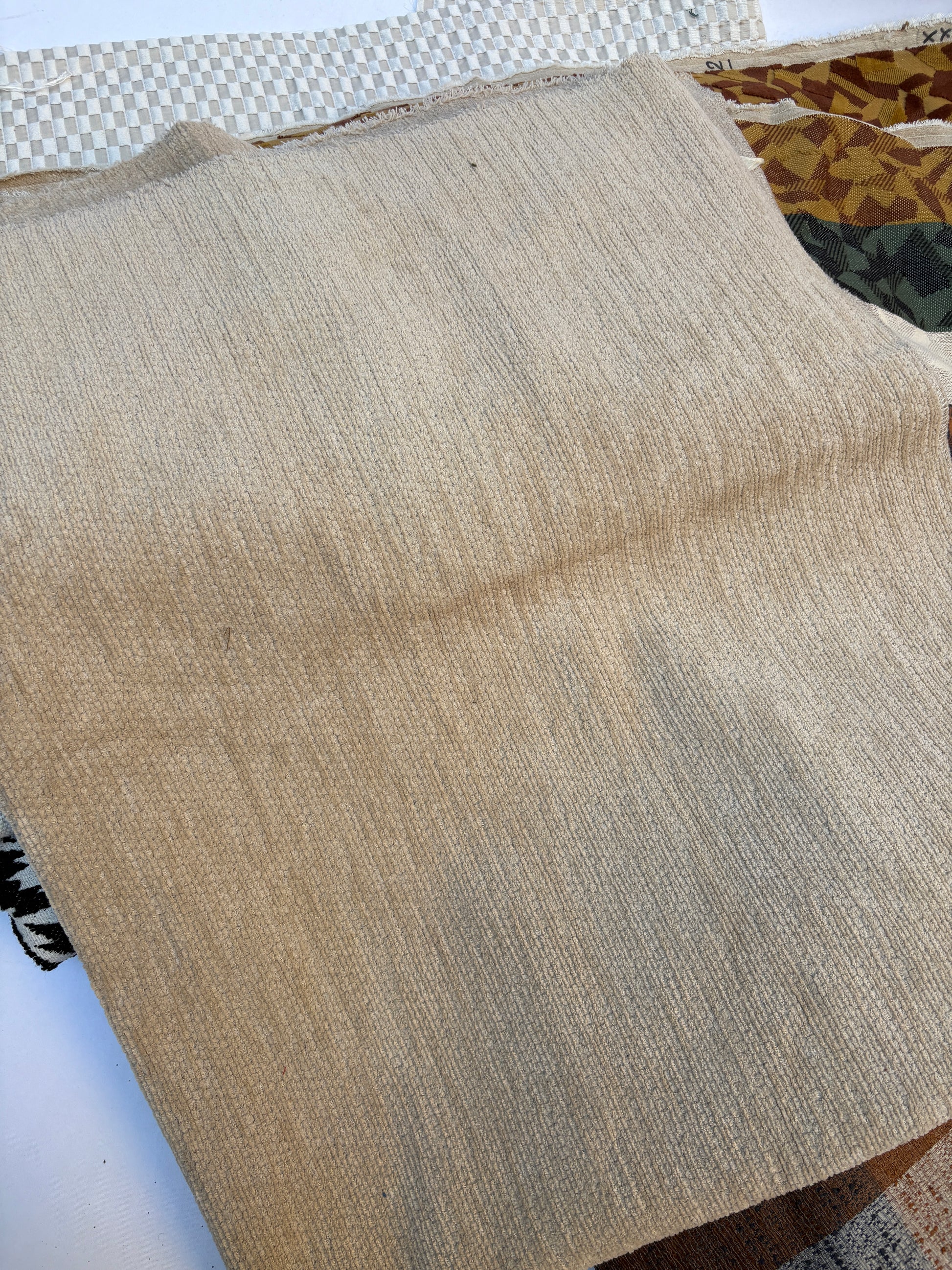 Close-up of beige fabric with a textured pattern
