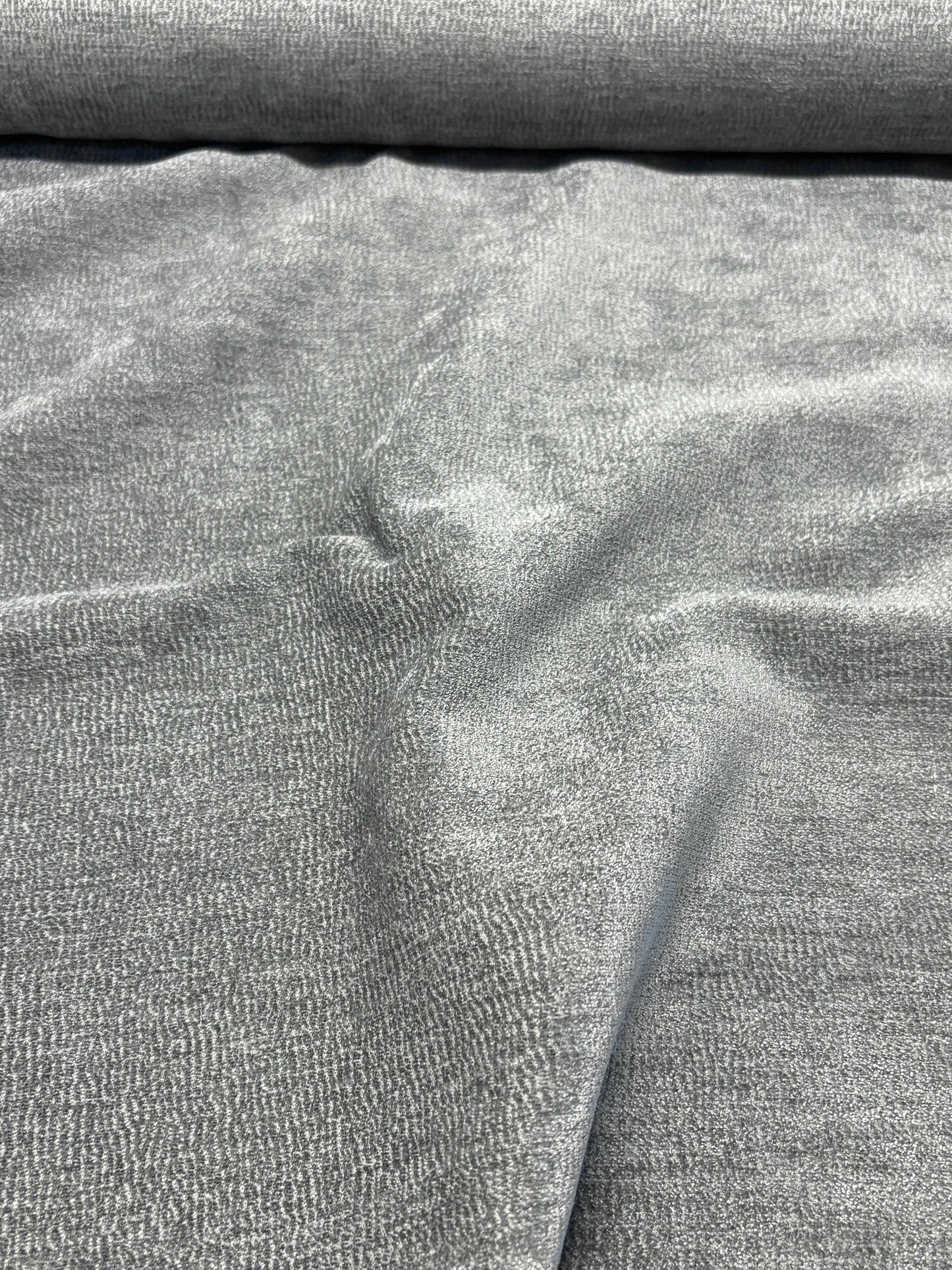 Close-up of grey textured weave velvet fabric