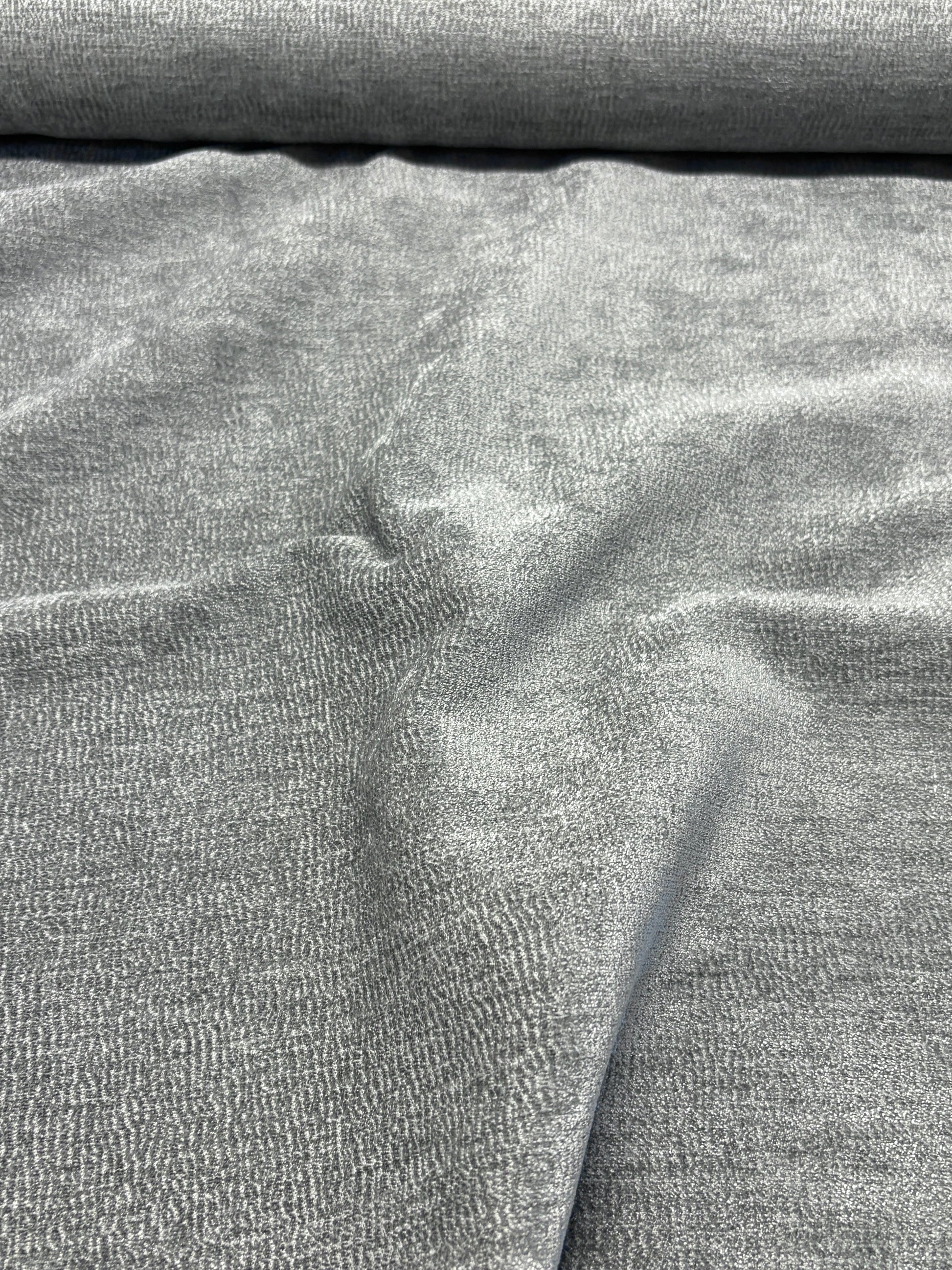 Close-up of grey textured weave velvet fabric