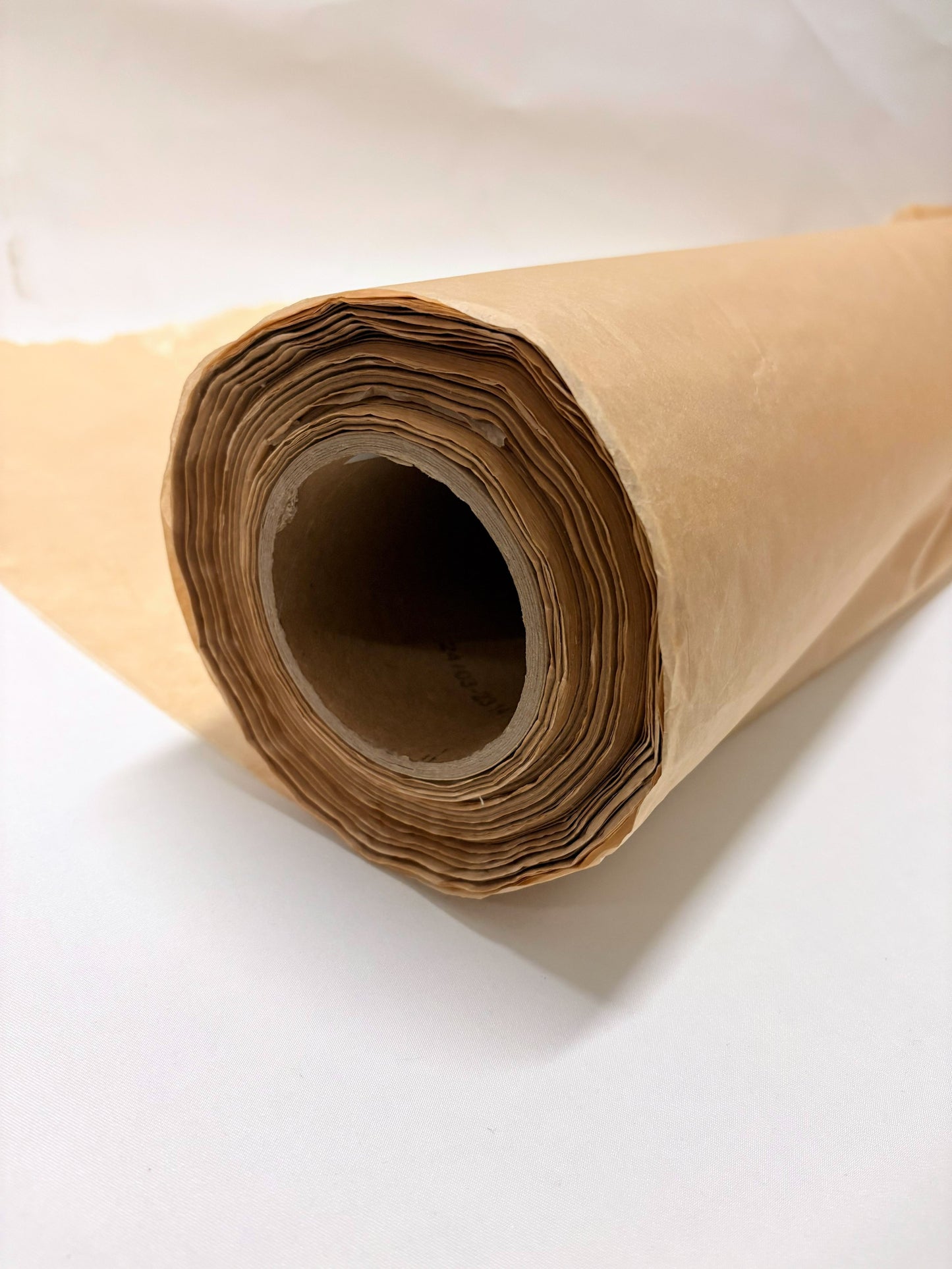 Close-up of a roll of brown tissue paper from its edge