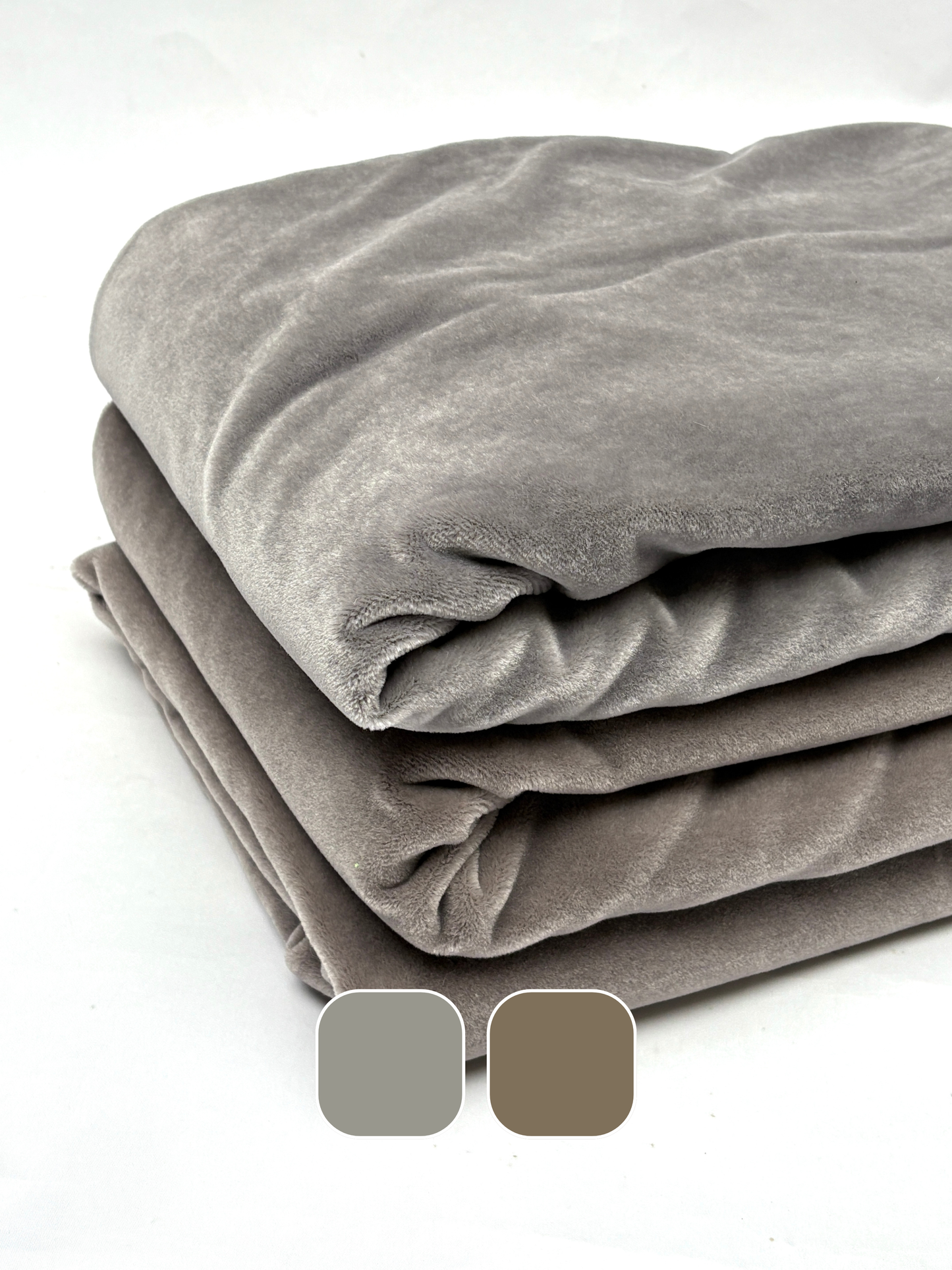 Stack of folded gray blankets and brown blankets with color swatches on a white background