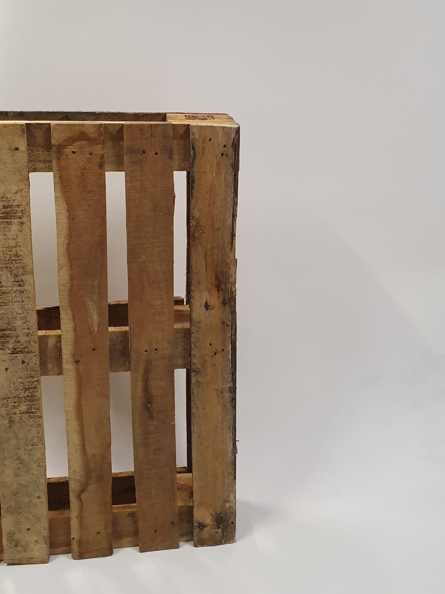 Standing wooden pallets with white background. 