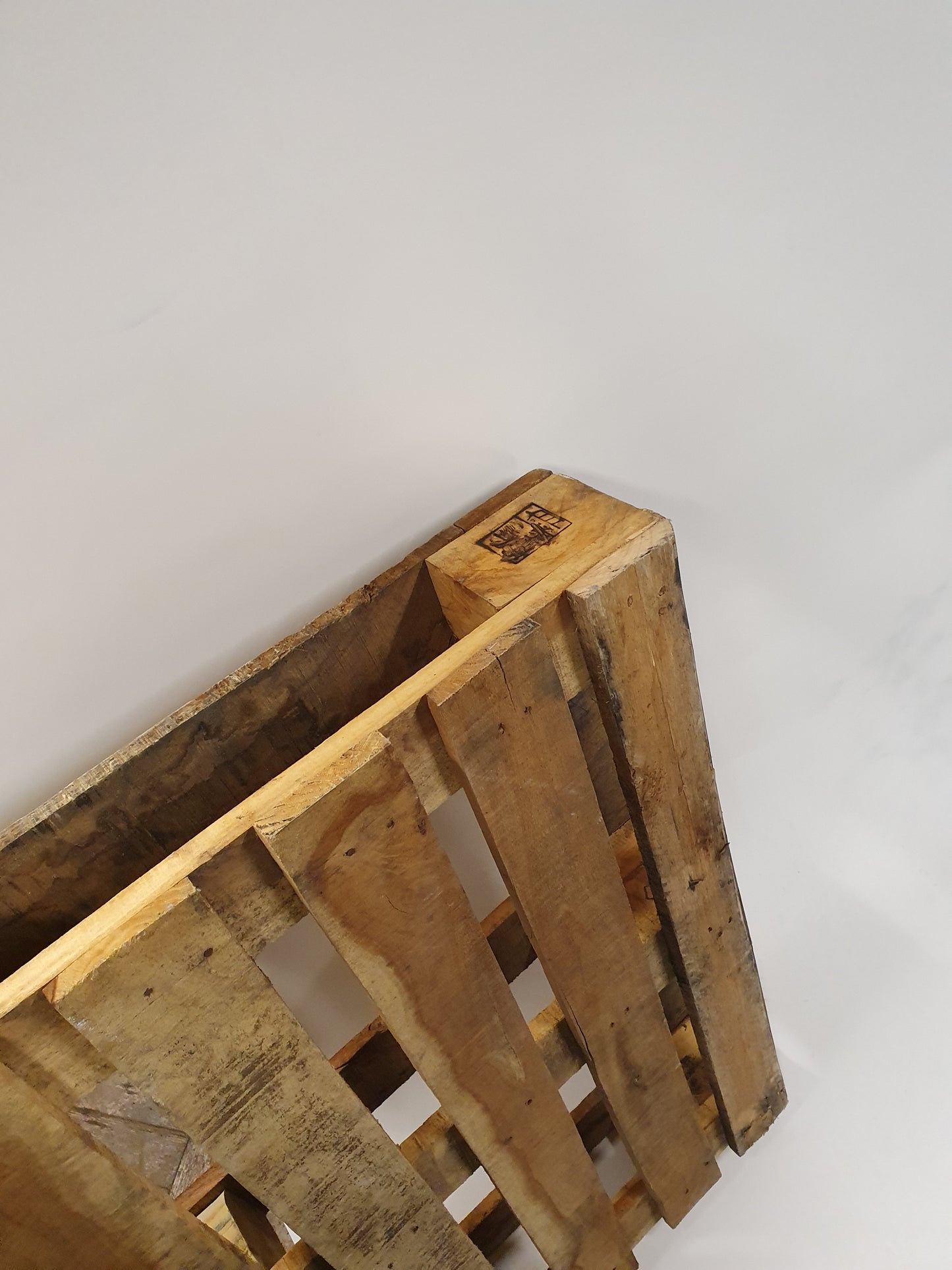 A close up of wooden pallets showing its side. 