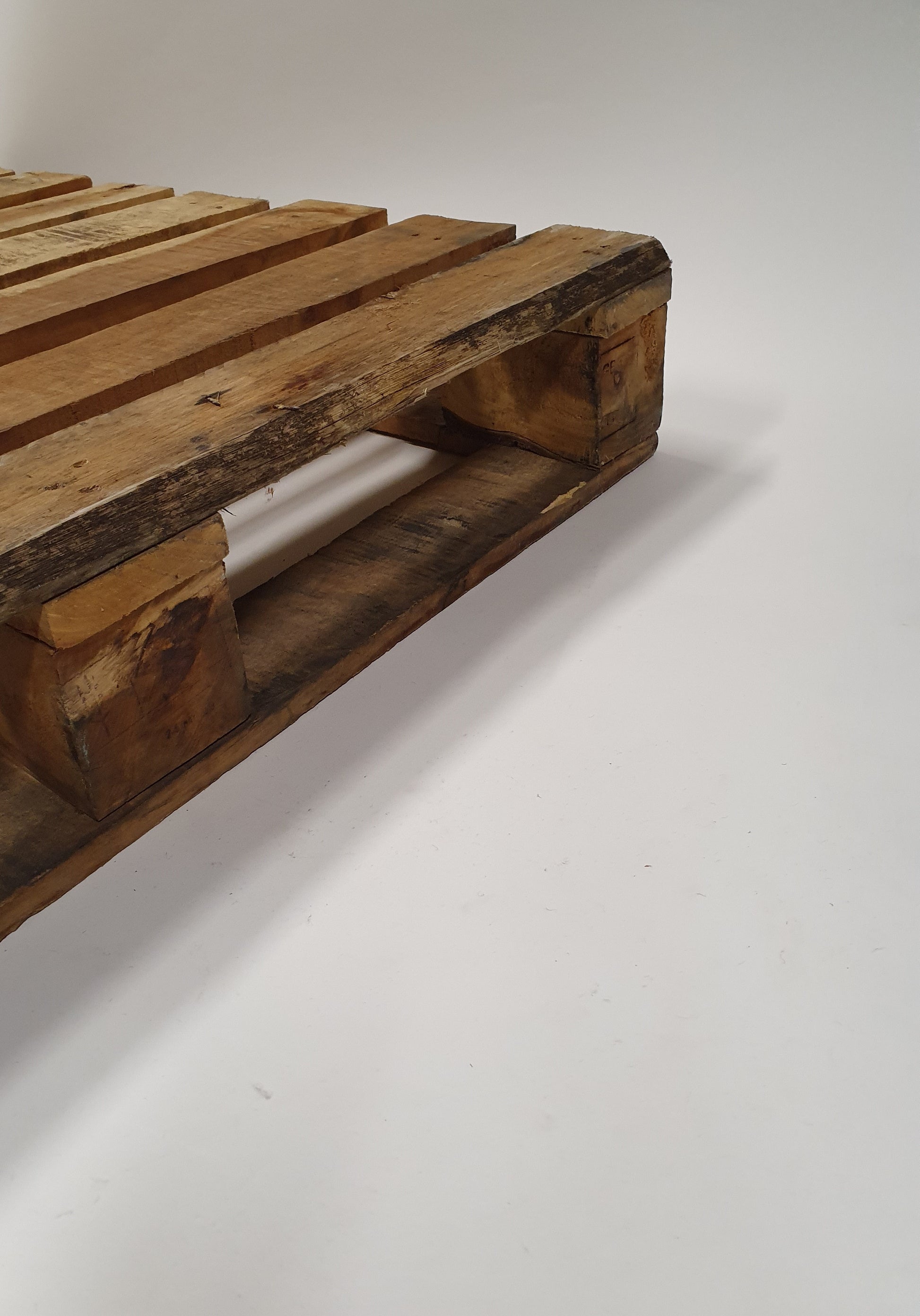 A close up of wooden pallets from its side. 