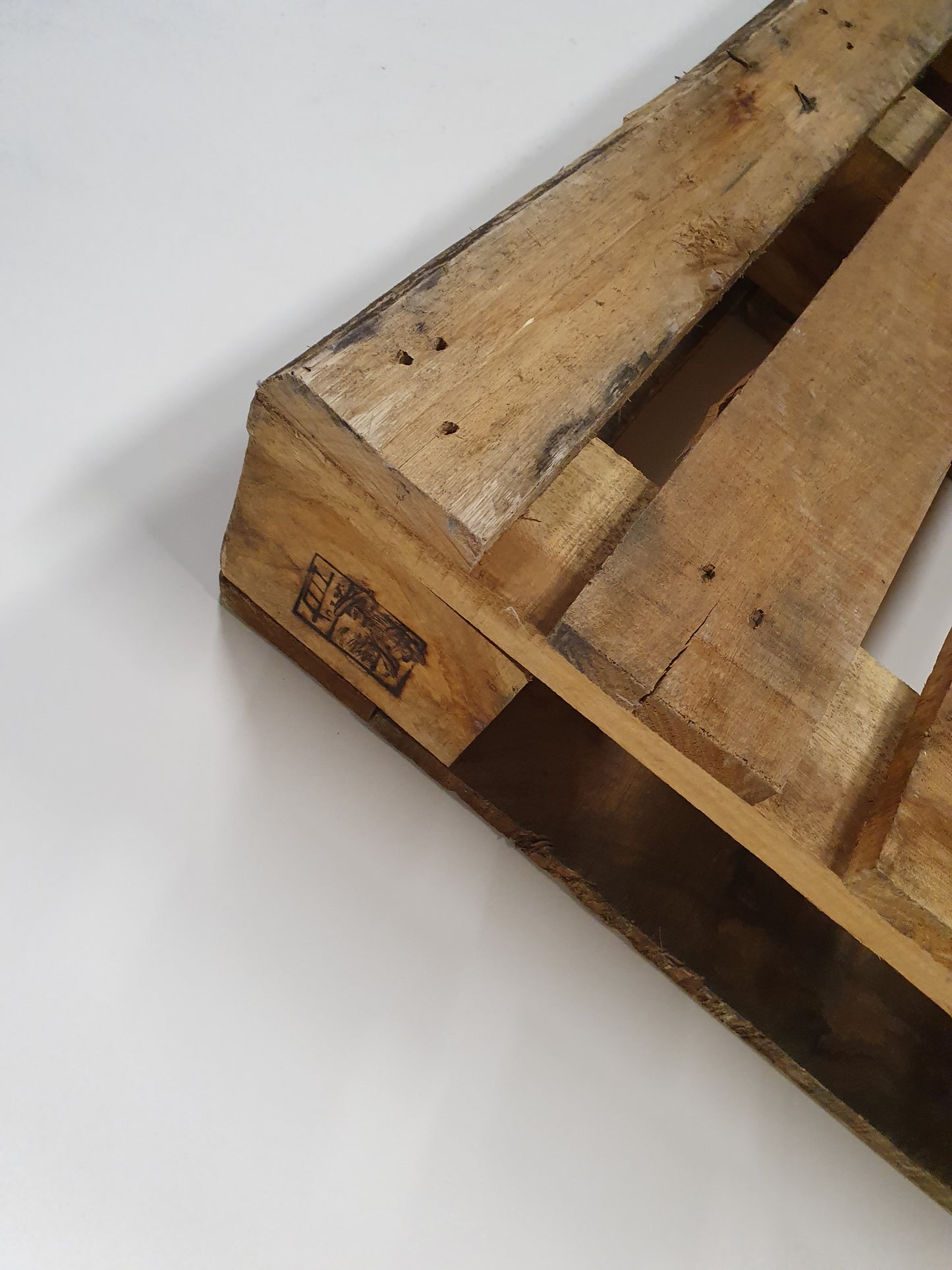 A close up of wooden pallets of its edge. 
