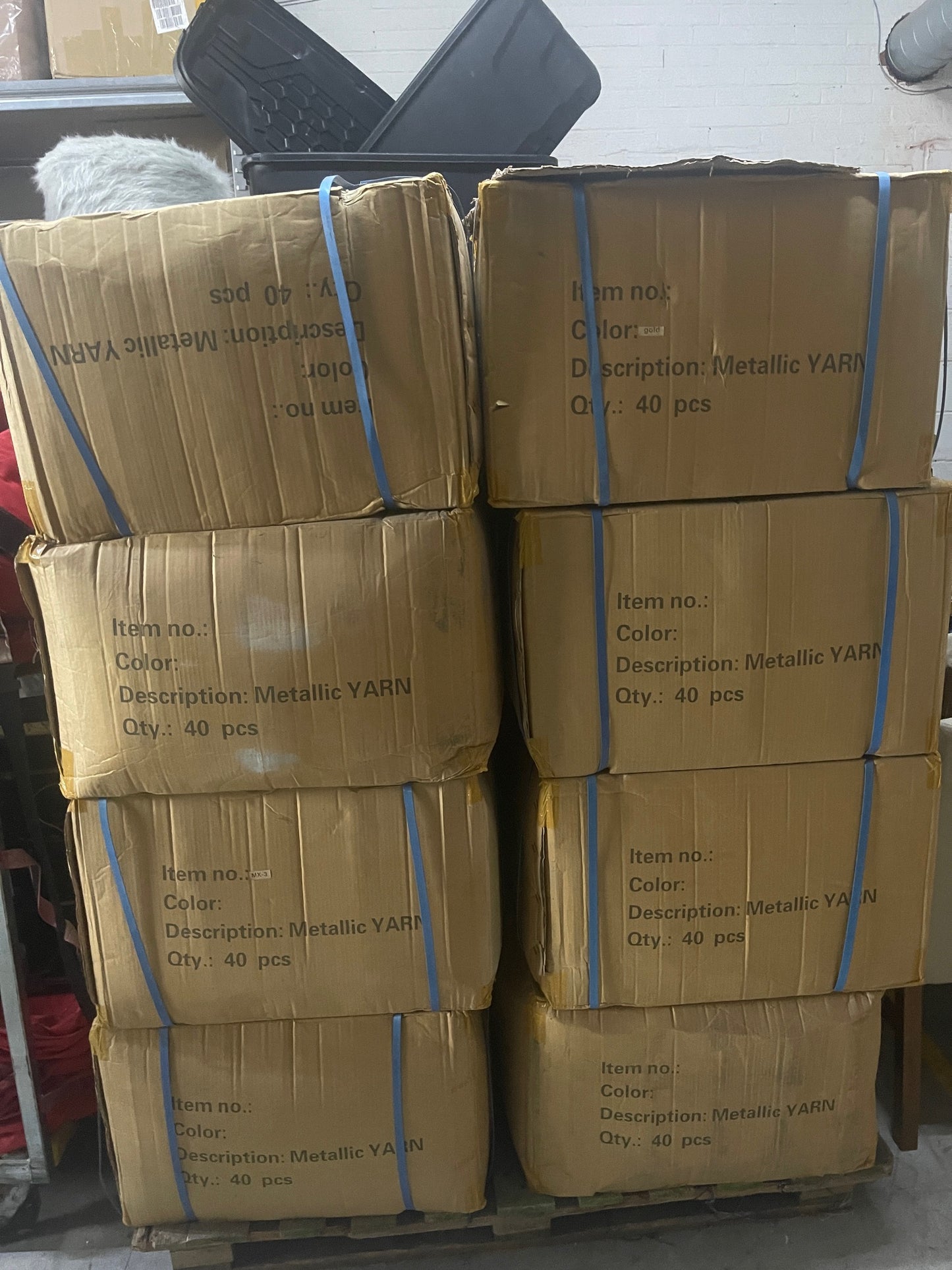 8 boxes containing 40 metallic yarn cones each box. 