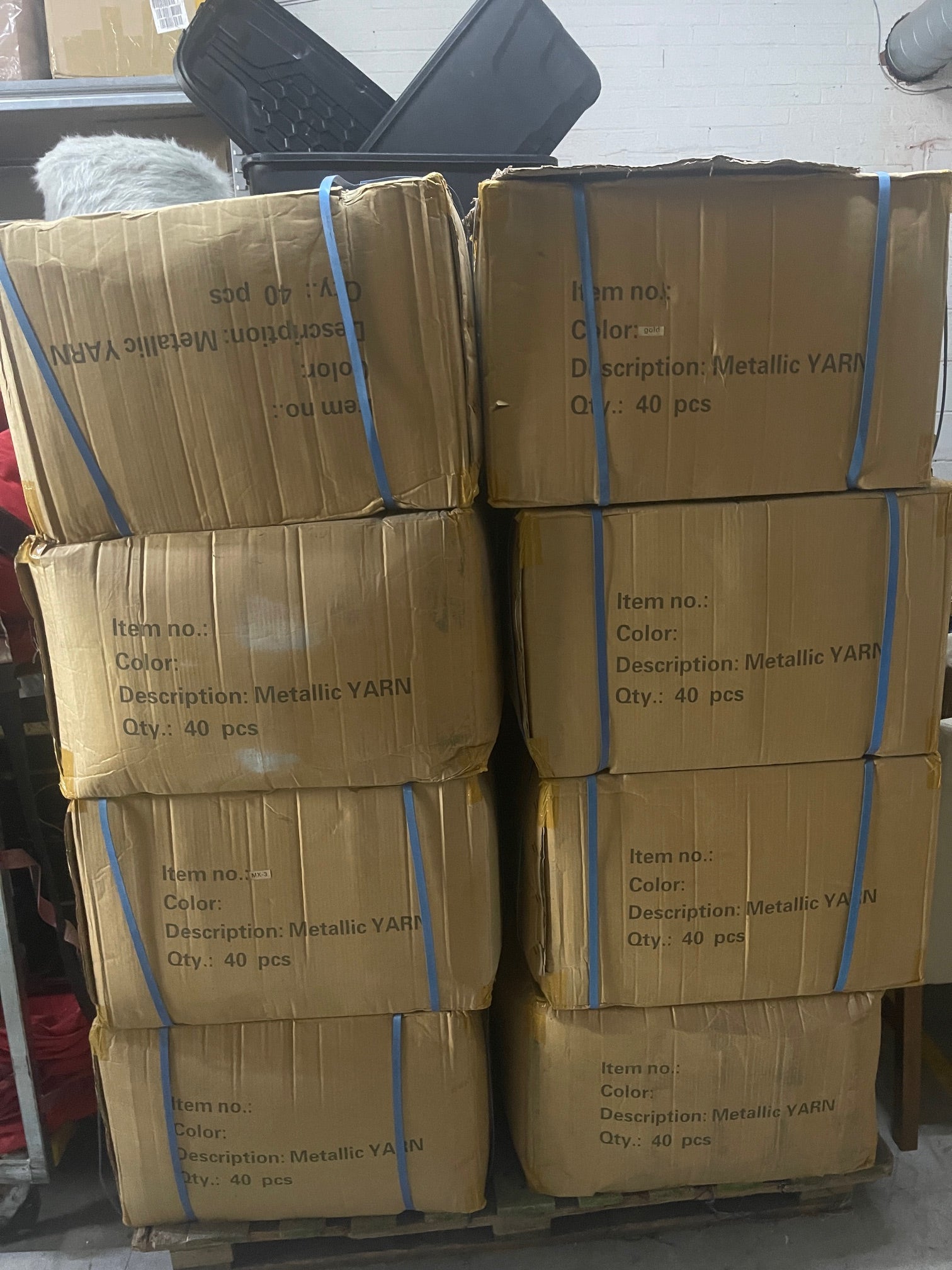 8 boxes containing 40 metallic yarn cones each box. 